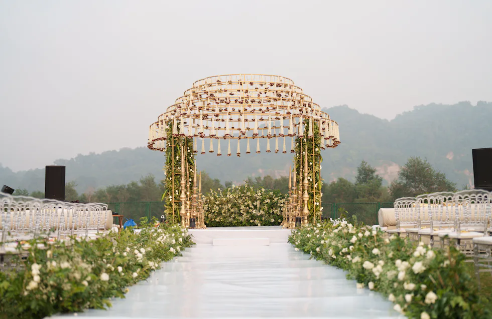 Floral wedding mandap set up on an open lawn